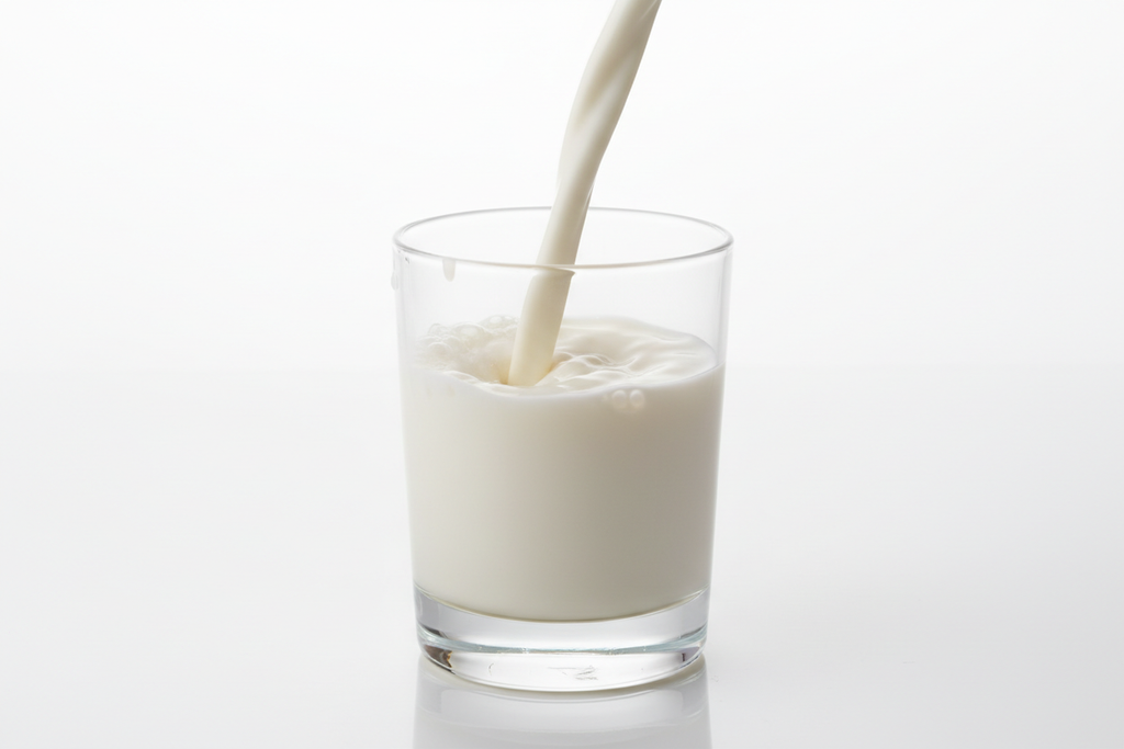 Fresh Goat Milk Being Poured